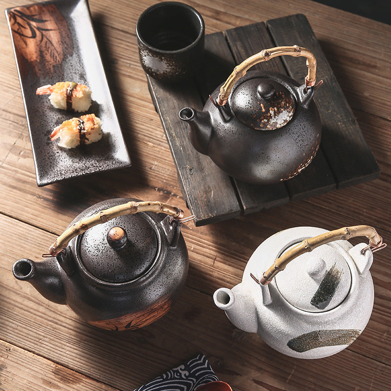 BIG IN JAPAN, RATTAN ceramic teapot with handle.