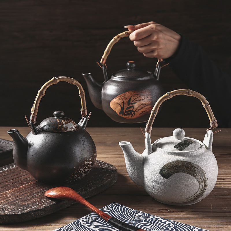 BIG IN JAPAN, RATTAN ceramic teapot with handle.