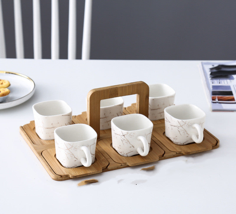 NORDIC EDGE ceramic teacups + teapot with warming seat.